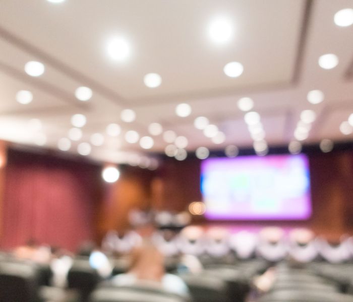 Abstract blur audience hall and conference meeting interior for background
